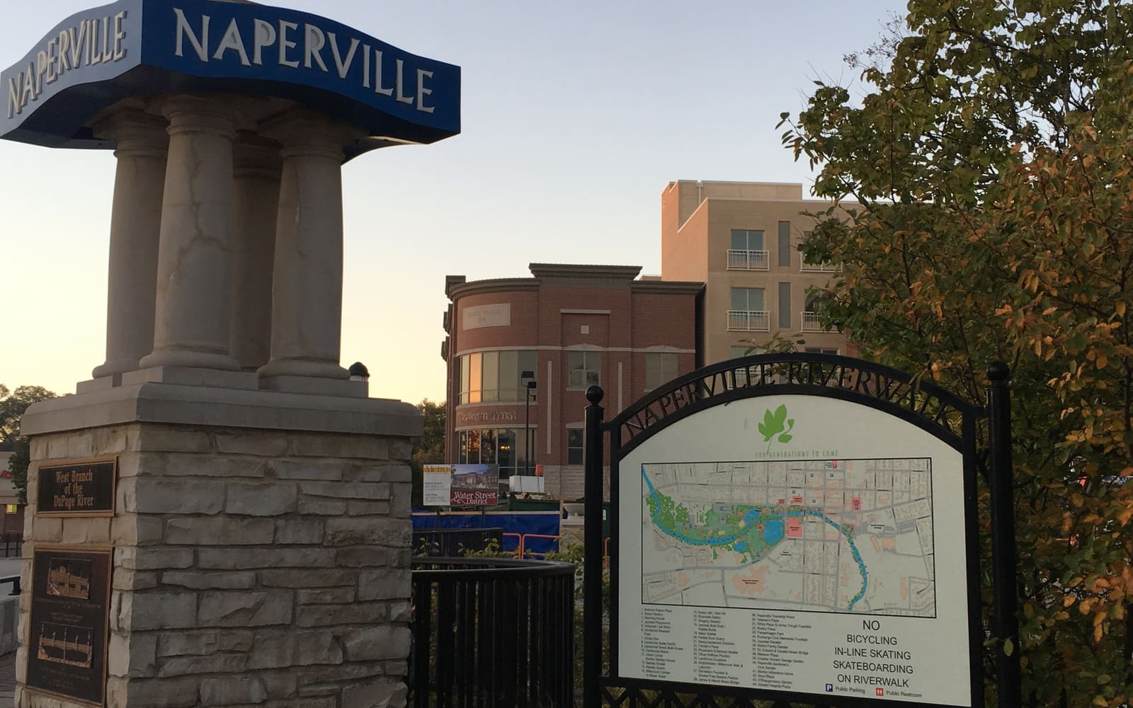 The Naperville Riverwalk entrance sign, a common wedding photo location in the western suburbs