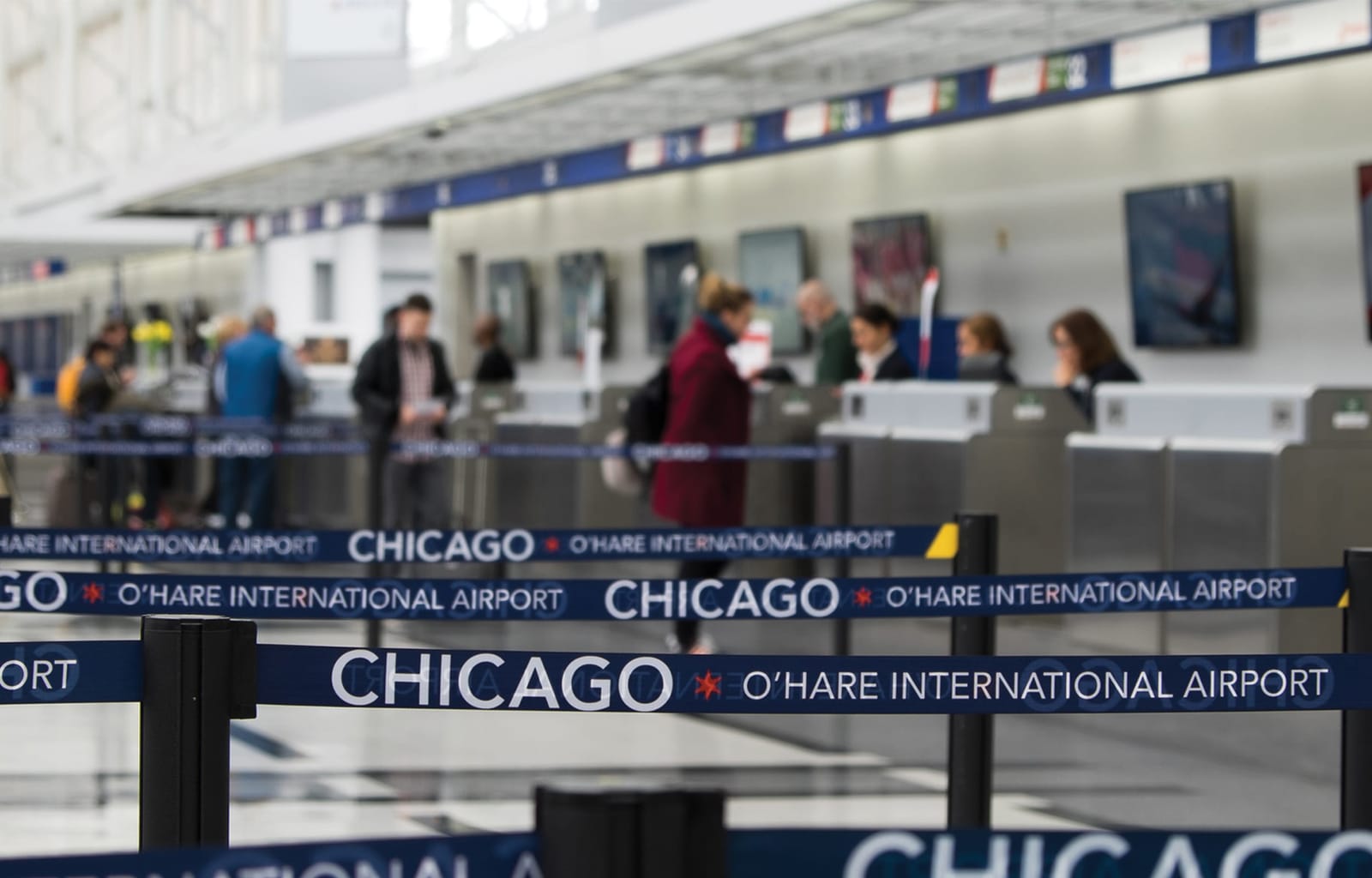 Airline check-in counters inside a terminal at Chicago O'Hare International Airport