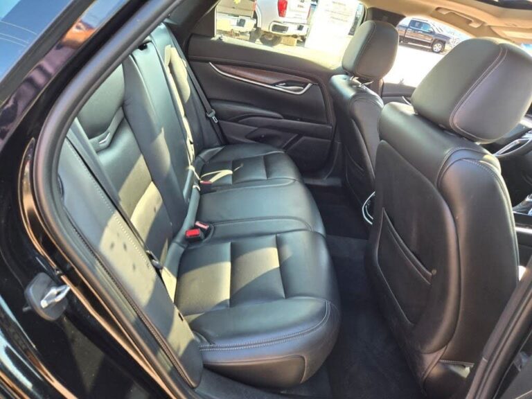 Passenger side of Black luxury sedan with leather interior for executive and airport transfers.