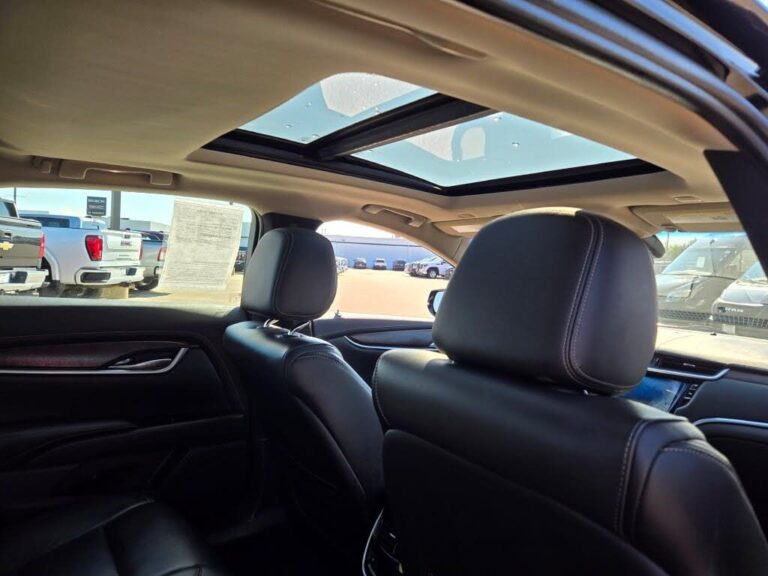 Sun and moon roof of Black luxury sedan with leather interior for executive and airport transfers.