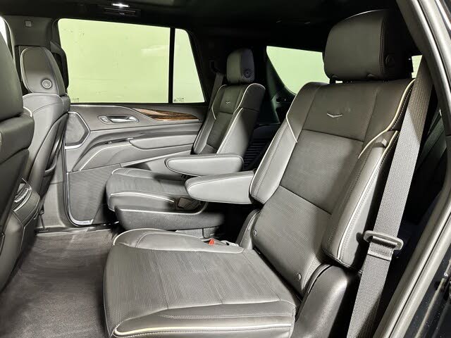 Second row of Cadillac Escalade Spacious full-size black SUV ideal for group travel or corporate clients.