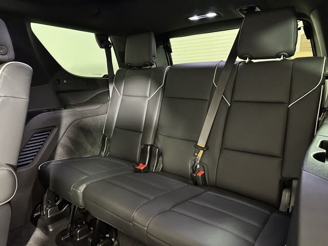 Third row of Spacious full-size black SUV ideal for group travel or corporate clients.