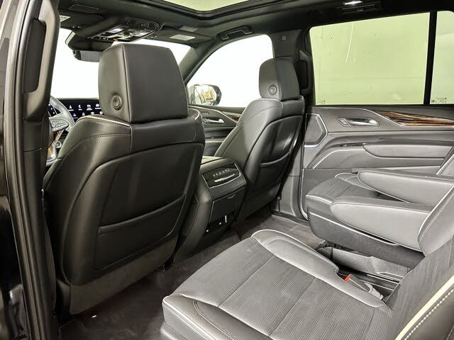 Second row of Spacious full-size black SUV ideal for group travel or corporate clients.