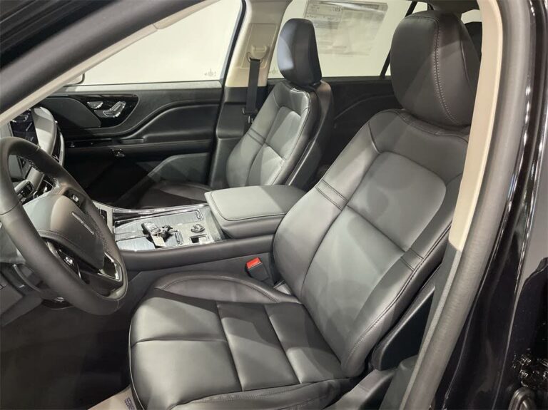 Front seats of Black luxury Mid-Size SUV with leather interior for executive and airport transfers.