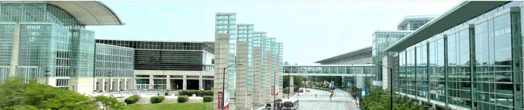 Exterior view of McCormick Place Convention Center in Chicago, showcasing modern architecture with glass structures and connecting bridges.